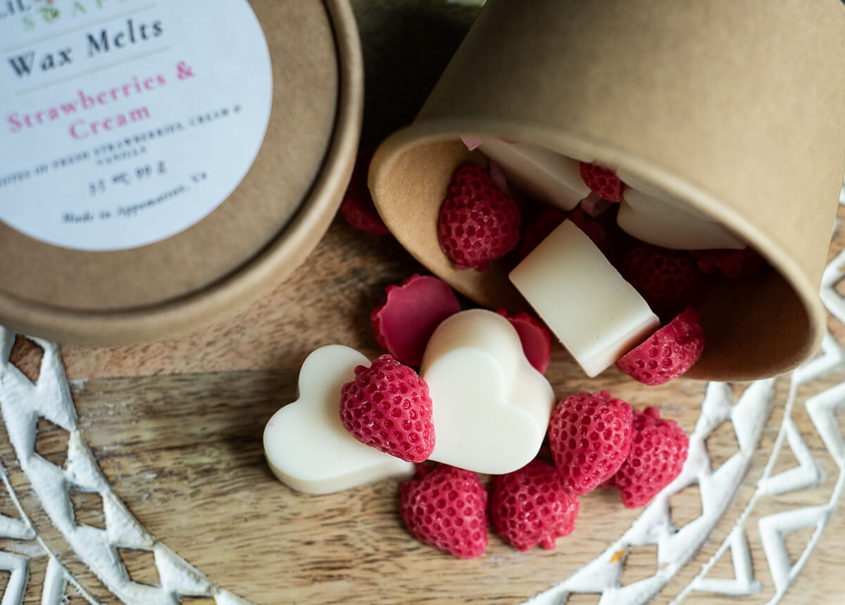 Little wild strawberries wax tarts nestled against vanilla hearts.