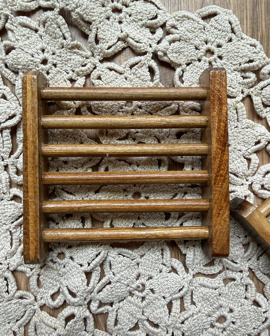 The Lil Daisy Soaps Bamboo Soap Ladder & Natural Fiber Soap Saver rests on a beige crochet doily.