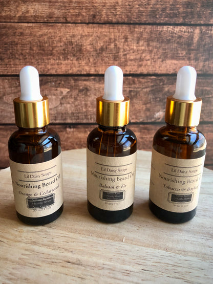 Three amber bottles of Lil Daisy Soaps Beard Oil to soften coarse hair and deeply condition your beard.