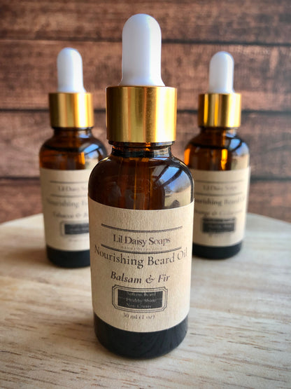 Three Lil Daisy Soaps Beard Oil dropper bottles, Balsam & Fir, to soften coarse hair on a wooden surface.