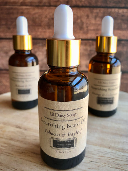 Three brown Lil Daisy Soaps Beard Oil bottles for softening coarse hair on a wooden surface.