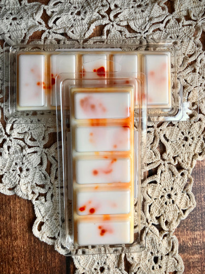 Citrus & Clove Snap Bar Wax Melts by Lil Daisy Soaps add cozy fragrance, displayed on a crocheted doily.
