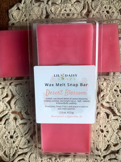 The Desert Blossom Wax Melt-Long Lasting Snap Bar by Lil Daisy Soaps sits on a crocheted doily.