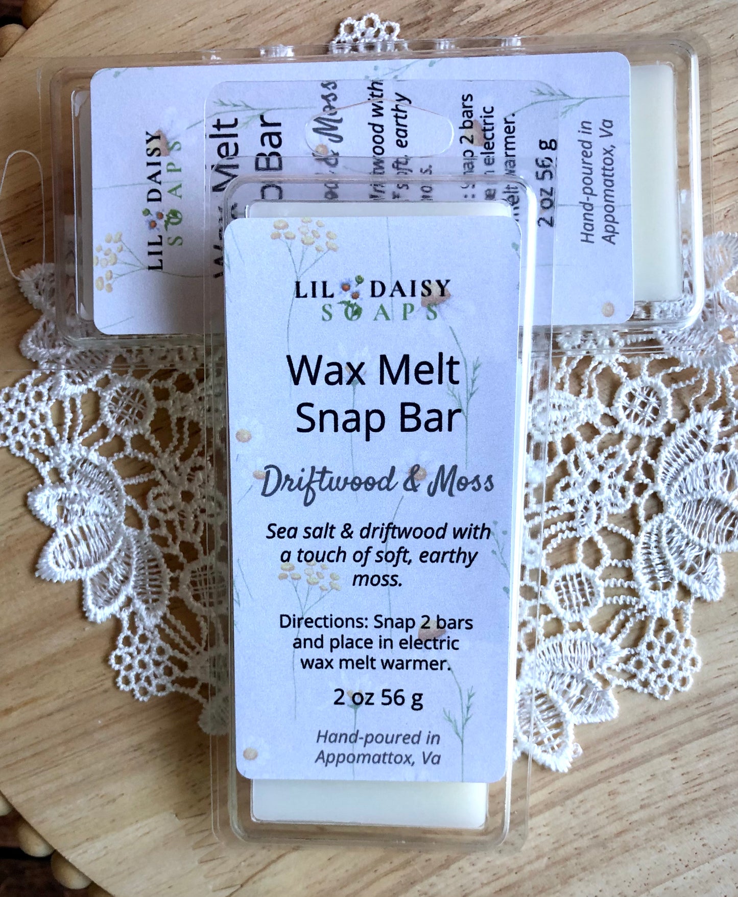Lil Daisy Soaps Driftwood & Moss Wax Melt Snap Bars offer a fresh coastal scent in a long-lasting formula.