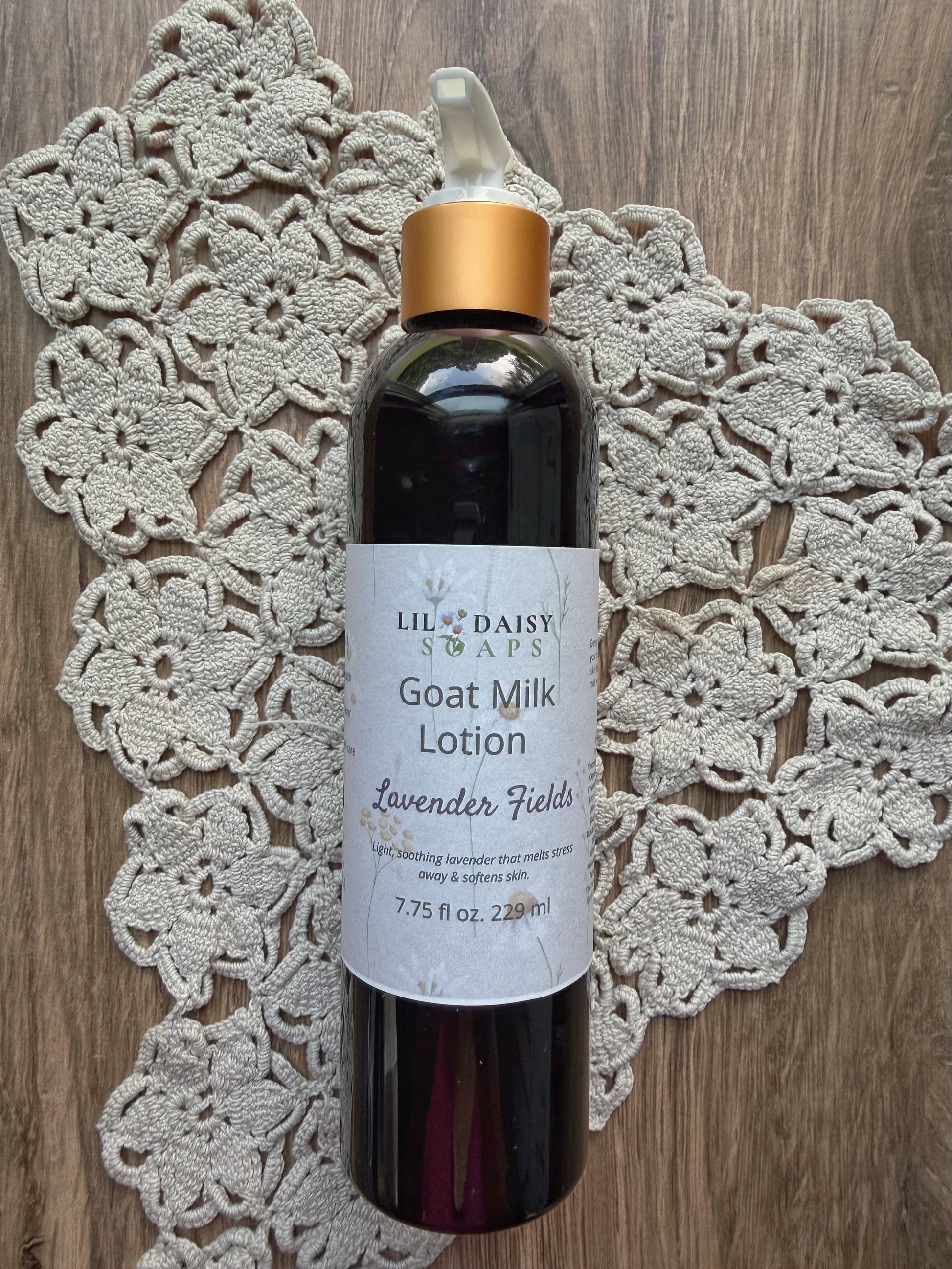 Lil Daisy Soaps Goat Milk Lotion rests on a doily, delivering lightweight daily moisture for soft, healthy skin.