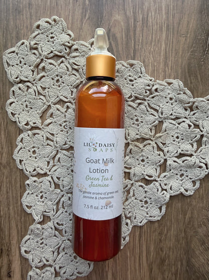 Lil Daisy Soaps Goat Milk Lotion sits on a crocheted doily on wood; a lightweight daily moisturizer.
