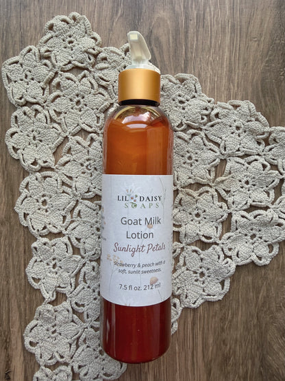 A bottle of Lil Daisy Soaps Goat Milk Lotion rests on a crocheted doily atop a wooden surface.