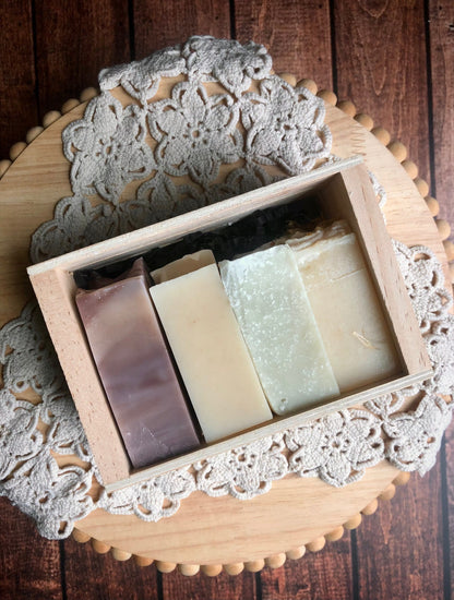 Lil Daisy Soaps Goat Milk Soap Sample Set: four handcrafted bars in a wooden box on a crocheted doily.