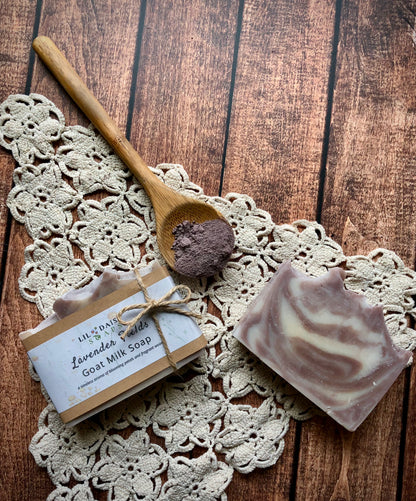Lavender Fields Goat Milk Soap Bar by Lil Daisy Soaps, on a lace doily and wooden table.
