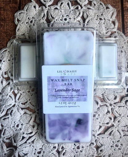 A wax melt snap bar labeled Lavender Sage sits on a crocheted doily on a wooden surface.