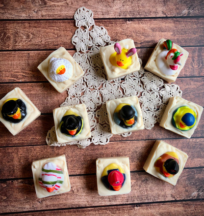 Lil Daisy Soaps Rubber Ducky Goat Milk Soap bars topped with colorful ducks, arranged on a doily.