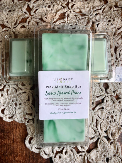 Snow Kissed Pines Snap Bar Wax Melts by Lil Daisy Soaps on a lace doily background.
