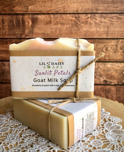 Two Sunlit Petals Goat Milk Soaps by Lil Daisy Soaps, handmade and wrapped in paper and twine.